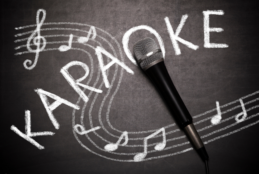 Word karaoke with microphone and music notes.