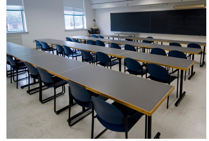 Picture of classroom with tables and chairs