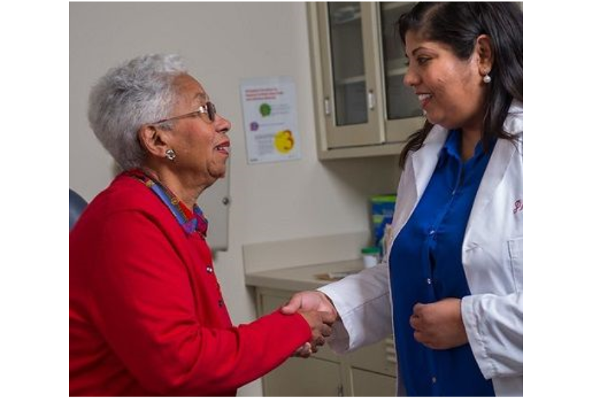 A Doctor shaking hands with patient