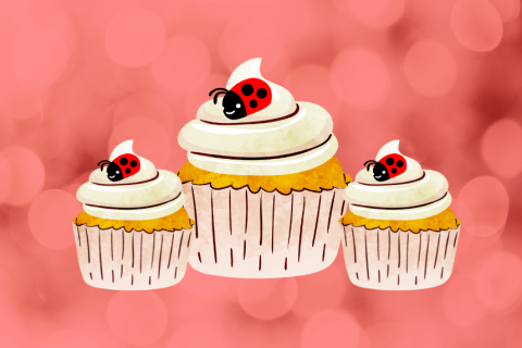 Three cupcakes with ladybugs on them