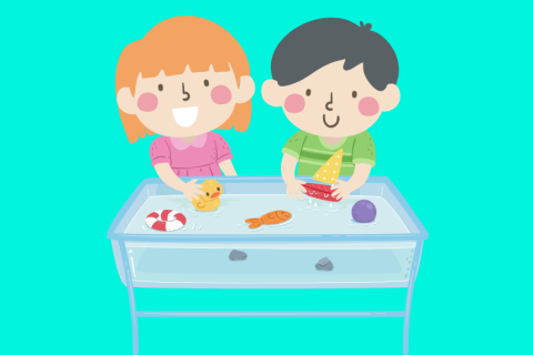 Two children playing with a water tank seeing what items float and what items sink.