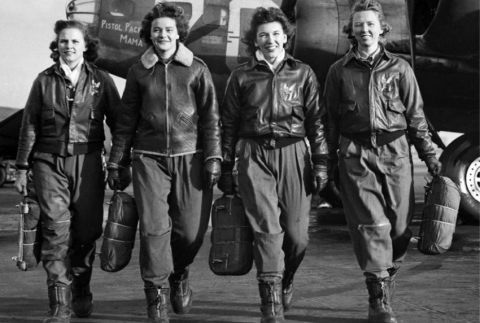 Front view of four women pilots walking. 
