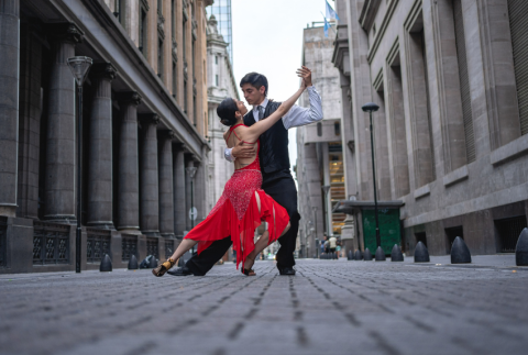 Two adults posing in a tango form.