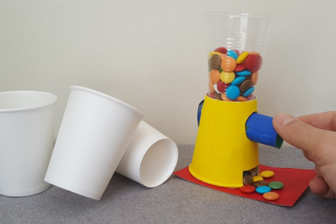 candy inside a candy machine made of cups