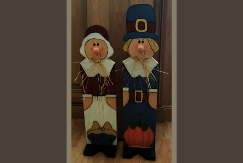 Two wooden pilgrim crafts. 