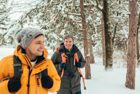 Two men hiking in snow.