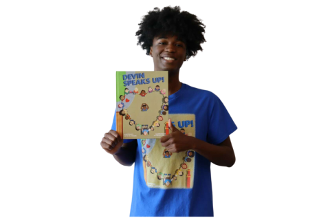 Devin holding his book