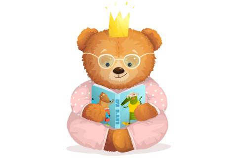 A teddy bear reading a book in pajamas