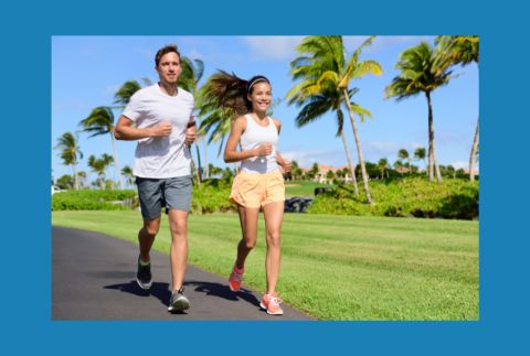 Two people outside running. 