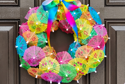 Wreath on a door made out of paper parasols. 