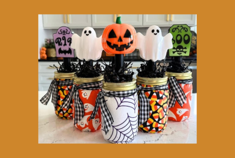Mason jars with Halloween decorations. 