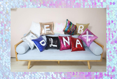 Sequin pillows on a couch. 