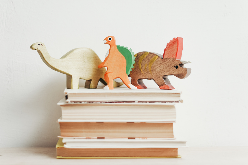 Dino toys on books