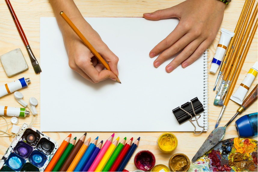 Picture of hands drawing on paper