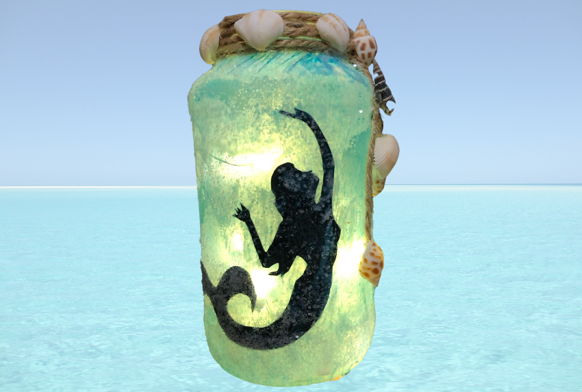 Mason jar with mermaid silhouette. 