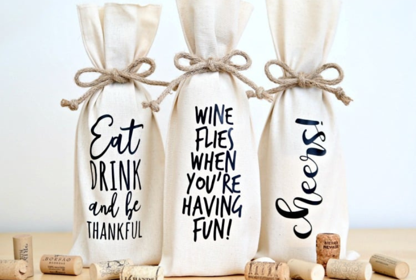 Picture of three wine tote bags with sayings on them 