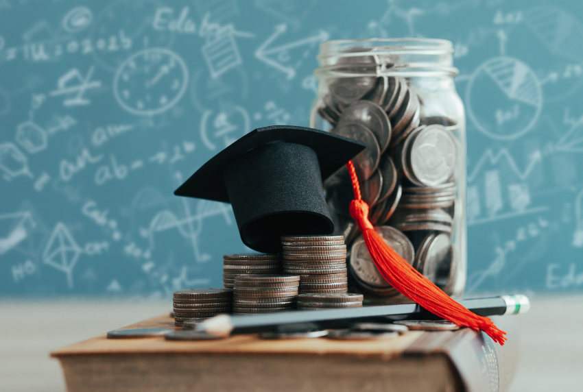 Bunch of coins with a graduation cap on top.