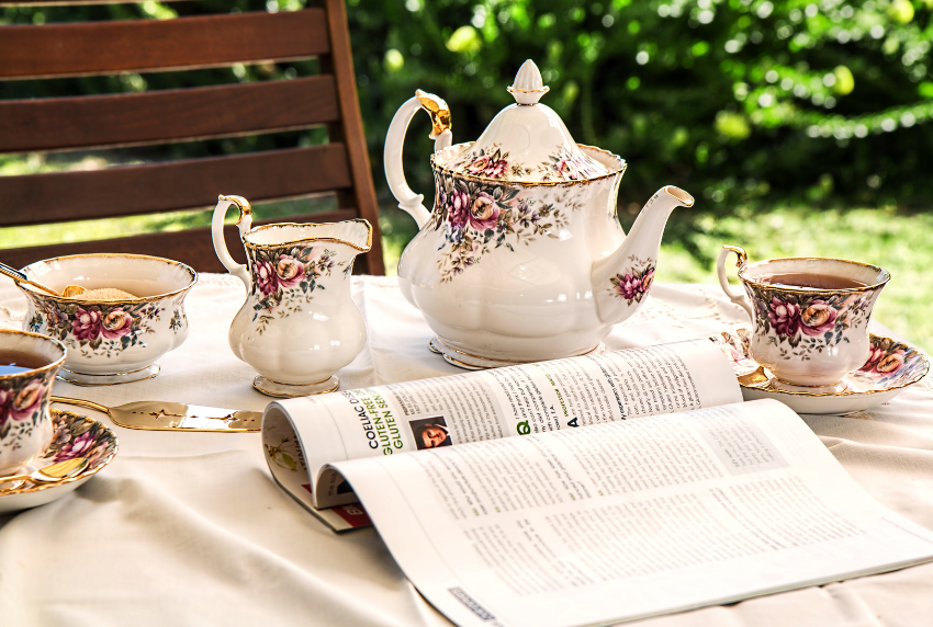 Victorian tea set with an open book. 