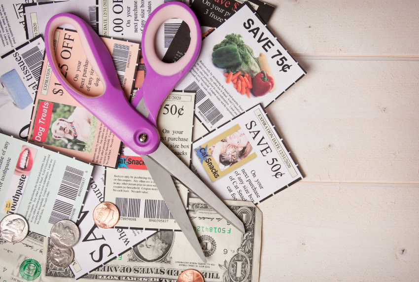 Top view of coupons and a scissor. 