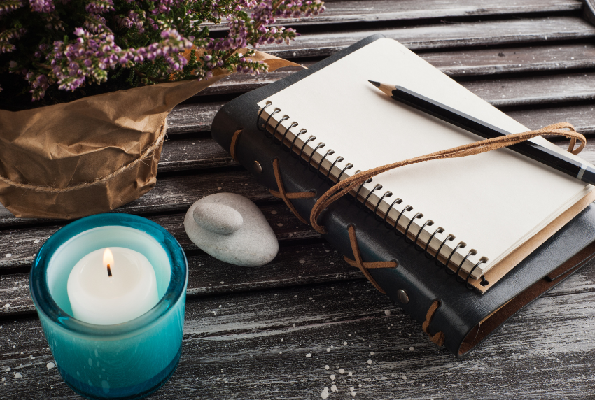 Top view of journal and a candle. 