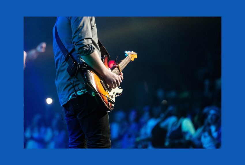 Person playing a guitar. 