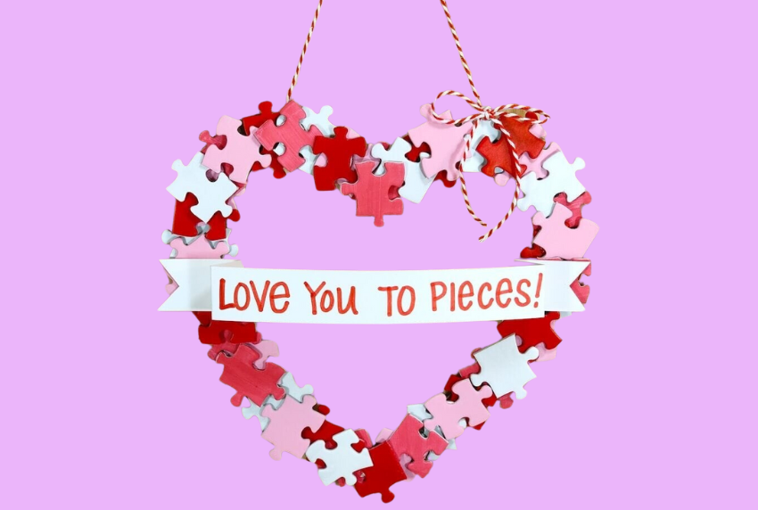 Heart shaped wreath made out of puzzle pieces.