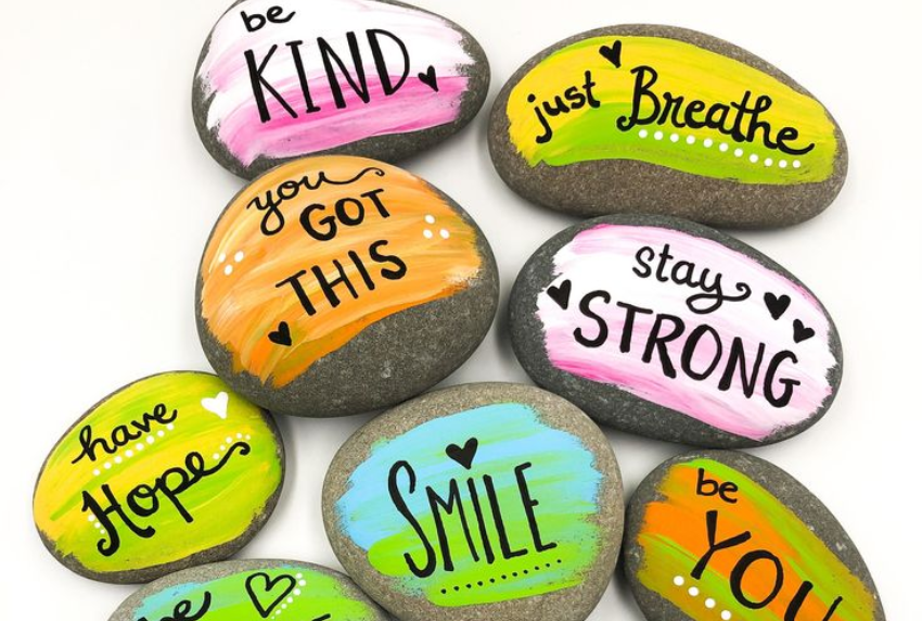 Painted rocks with words of kindness.