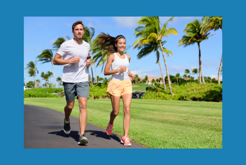 Two people outside running. 