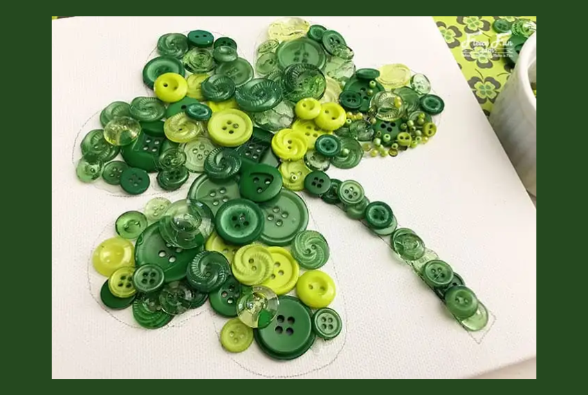 Top view of green buttons shaped into a shamrock. 