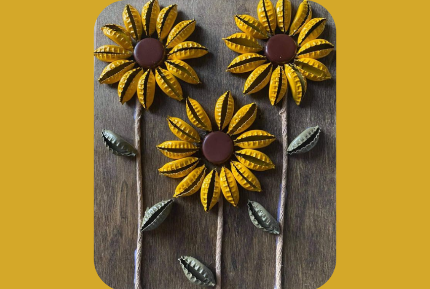 Three sunflowers made our of bottle caps. 