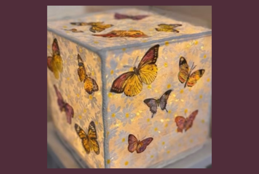 Lamp decorated with butterfly napkins. 