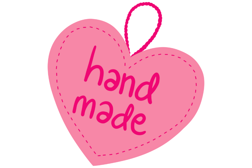 Heart keychain that says hand made