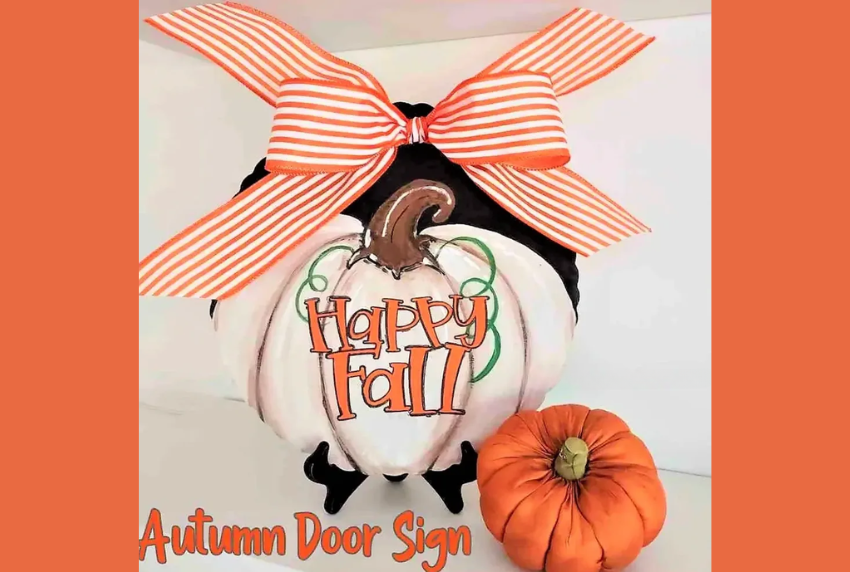 White pumpkin painting with the words happy fall. 