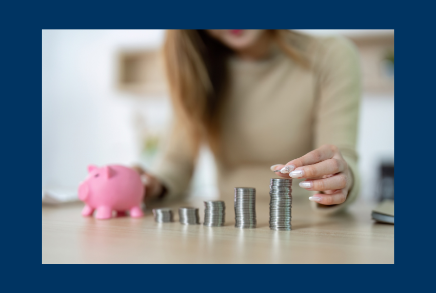 Person stacking coins. 